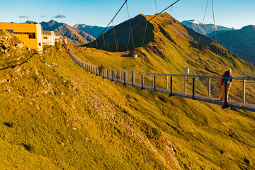 Alpine summer evening view with the famous touristic suspension bridge at Mount Stubnerkogl, Bad...