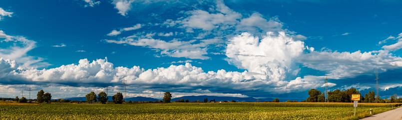 High resolution stitched summer panorama with storm clouds and the Bavarian forest at...