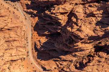 Top down aerial view of a wash in Southern Nevada featuring jagged Mars or alien like rock formations