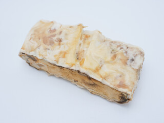 rotten and moldy tempeh, expired tempeh isolated on white background