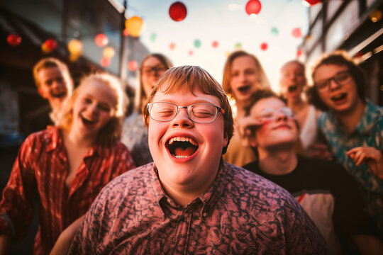 A cheerful boy with Down syndrome celebrates his birthday with his beloved friends
