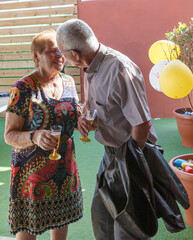 Enduring Romance: An Elderly Kiss in Celebration
