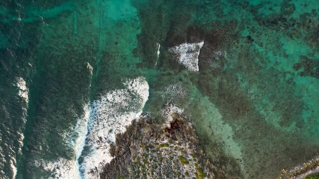 Drone video of waves crashing over rocks in Mexico