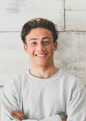 one teenager at home smiling happy at the camera - simple photo of handsome young man looking with...