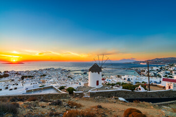 Traditional windmill of Mykonos island at sunset, Greece