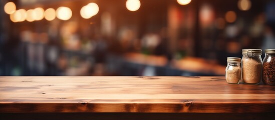 Blurry background of a modern restaurant room or coffee shop with an empty table for product display mockup - obrazy, fototapety, plakaty