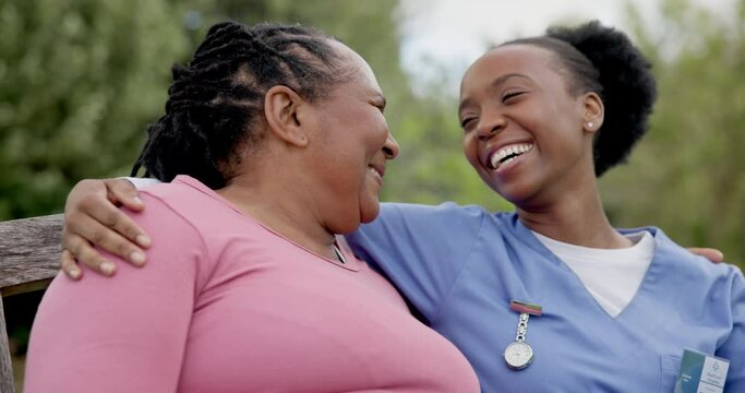 Garden, hug and mature woman with nurse, medical healthcare worker and bonding together in rehabilitation. African person, park and happy caregiver on bench, embrace and support for trust in nature