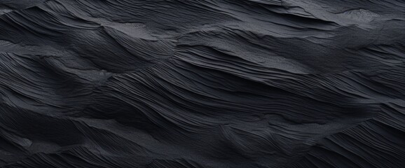 Black Sand dune. Black Sand beach macro photography. Background, texture, wave pattern of oceanic sand on the beach, black. Texture of beach sand. Black beach