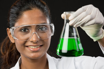 Woman scientist analyzing a solution.