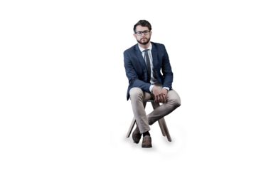 Portrait, glasses and business man on chair isolated on a transparent png background in Spain. Serious, professional entrepreneur in suit and confident salesman, worker and corporate employee career