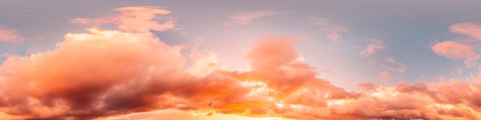 Dramatic sunset sky panorama with bright glowing red pink Cumulus clouds. HDR 360 seamless...