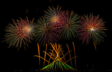 Fireworks show under defocus or blur concepts with isolated black background at night, this celebration is for the International Fireworks Festival in Pattaya on Nov 24-25 in Thailand