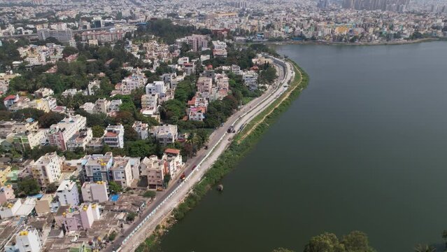 Aerial footage of Madiwala lake is one of the biggest lakes in Bangalore, India, spread over an area of 114.3 hectare. BTM lake Bridge. Vechiles moving with less frequency in the afternoon.