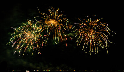 Fireworks show under defocus or blur concepts with isolated black background at night, this celebration is for the International Fireworks Festival in Pattaya on Nov 24-25 in Thailand