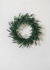 Simple minimalism style Christmas tree wreath on a white wall