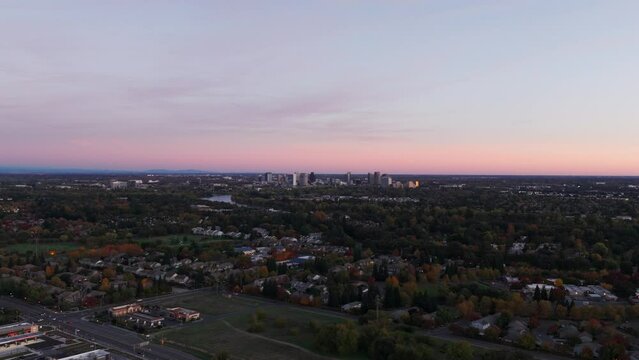 Wide angle push in shot of downtown Sacramento with a colorful sky background