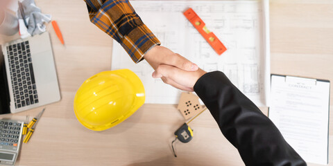 Construction team hands shaking greeting start up plan new project contract in office center at...