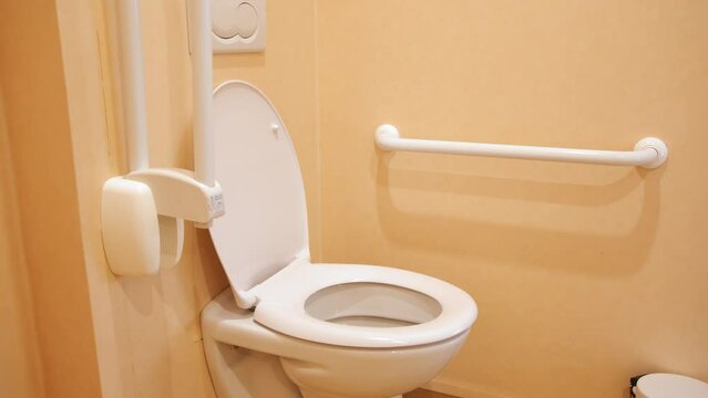 Accessible Toilet With Grab Rails. - close up shot