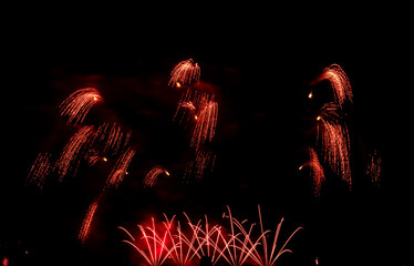 Fireworks show under defocus or blur concepts with isolated black background at night, this...