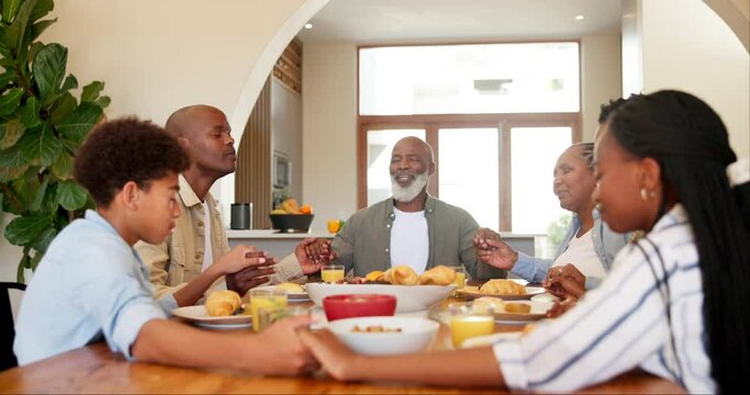 Black family, praying and dinner in home, holding hands and support with gratitude, faith and religion. Men, women and kids with care, love and food in house for connection, thanksgiving or brunch