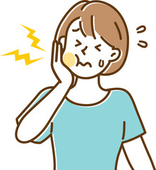 歯が痛くなって手でほっぺたを抑えている若い女性