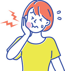 歯が痛くなって手でほっぺたを抑えている若い女性