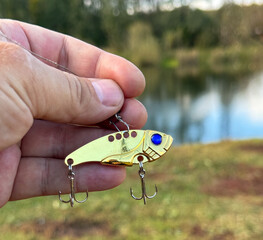 Spinner in hand Fish in nature