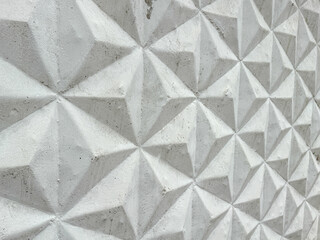 Patterned white concrete fence as background. Texture