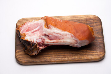 smoked pork on a wooden board, natural food