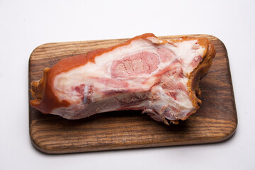 smoked pork on a wooden board, natural food