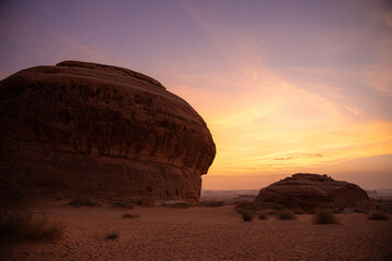 Saudi girl exploring Hegra in Medina Region on sunset time.