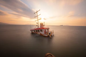 Foto op Canvas An old ship washed ashore © Samet