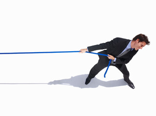 Businessman, frustrated and tug of war by white background, career challenge and industry...