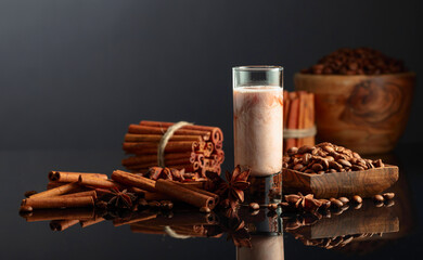Coffee liquor with cream on a brown background.