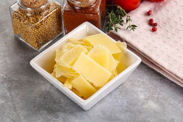 Sliced parmesan cheese in the bowl