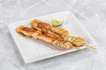 Grilled salmon skewer with sauce