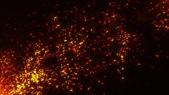 Flying sparks and coals from a fire. abstract glowing particles of burning fire and smoke on a black background, bonfire flares..