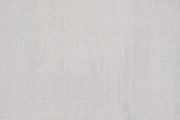 light gray wooden background with subtle wood grain texture