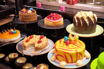 Vibrant cakes on display, bursting with color and sweetness. Such indulgence contrasts with the rising health-conscious trends.