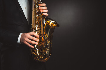 skilled hands of men play saxophone, capturing essence of musical expression and talent. close-up...