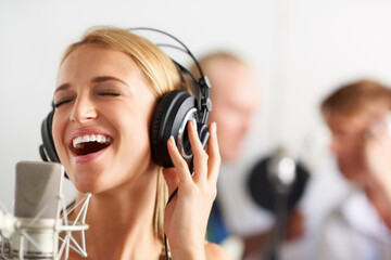 Music, singing and woman with microphone, headphones and band performance with talent. Recording...