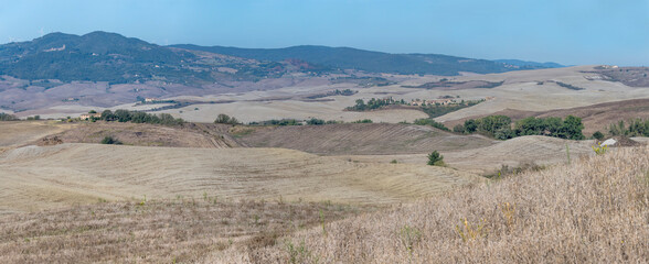 stubble fields in hilly countryside south of Volterra, Italy