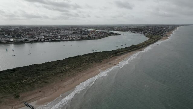 Normandy, France. 11-01-2023. Aerial view dunes separate the river from the sea. Cabourg Beach. Video 4K