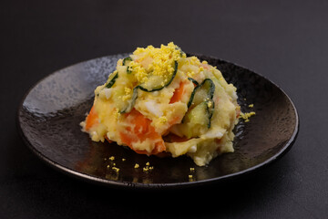Gamja Salad is Korean Potato Salad with Eggs, Carrots and Cucumbers.