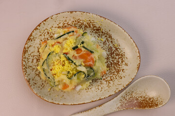 Gamja Salad is Korean Potato Salad with Eggs, Carrots and Cucumbers.