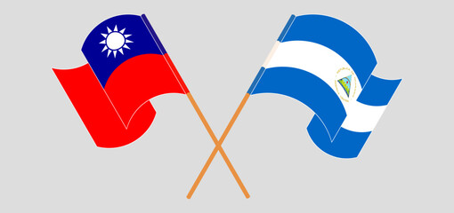 Naklejka premium Crossed and waving flags of Taiwan and Nicaragua