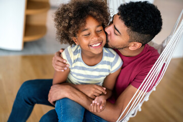 Happy african american single dad spends happy moments with his daughter. Family love concept - obrazy, fototapety, plakaty
