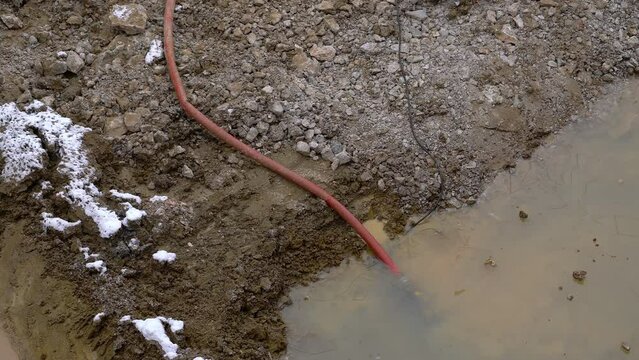 Construction works - Pumping out water, winter - (4K)