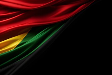 Abstract single Afican silky flag black, red, yellow, green on left side , Black background concept with copy space for text