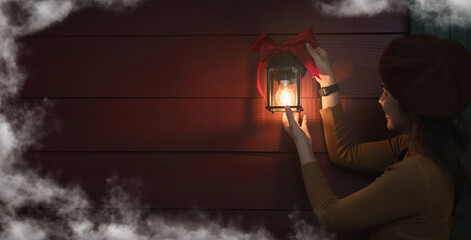 Christmas girl decorating lanterns at night Background image